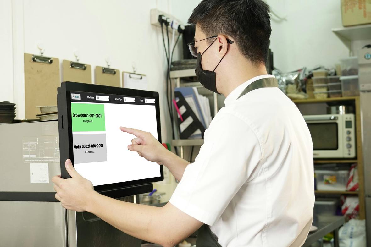 VisioEdge KOT screen in a kitchen showing one order completed and one in process