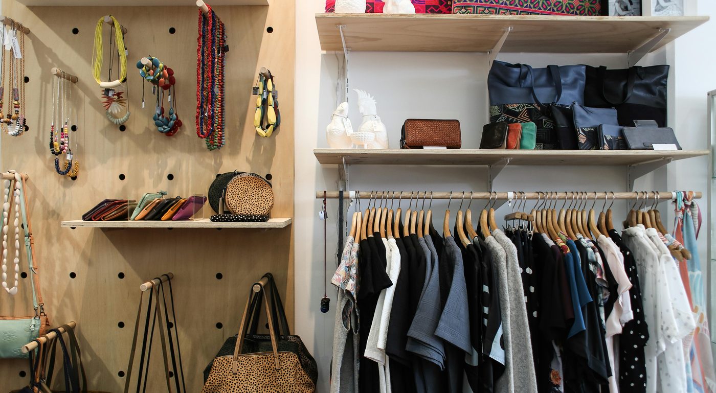 Clothing rails and accessory shelves in a retail store