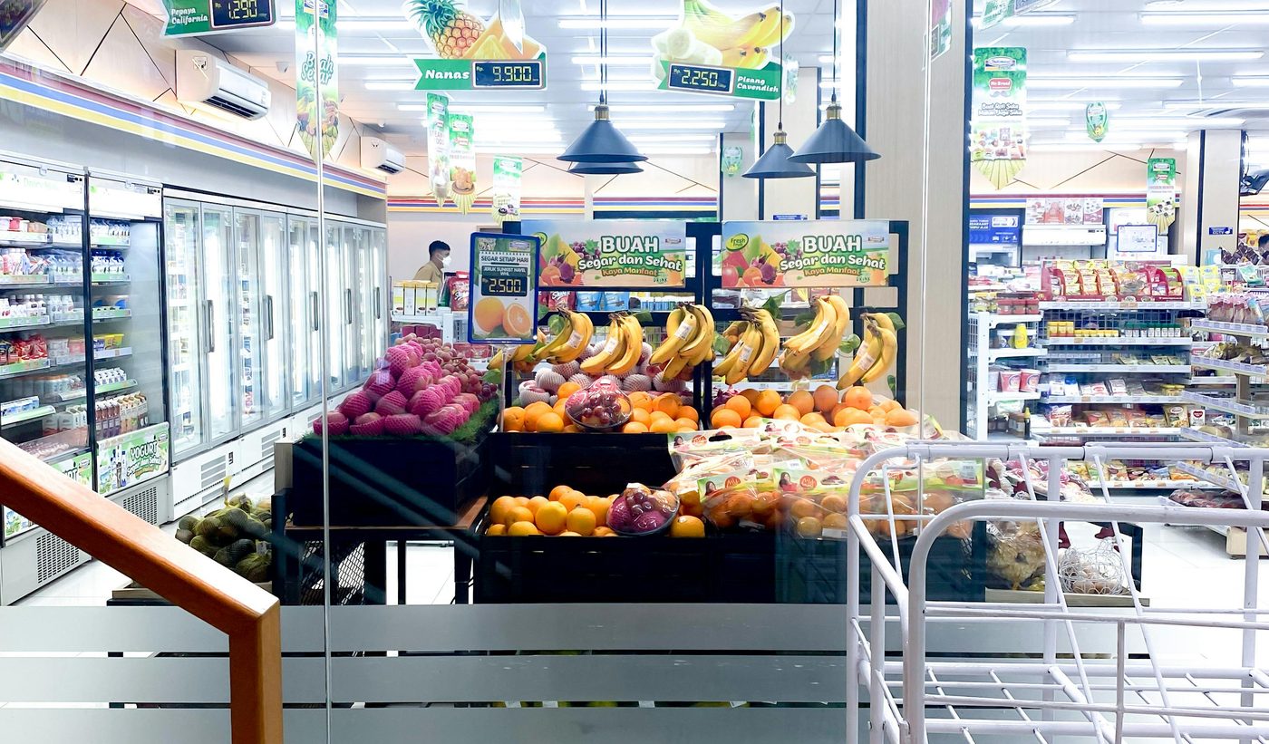 Fresh produce display and chilled aisles inside a supermarket